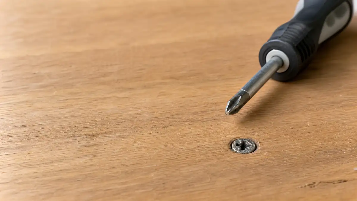 How to remove a stripped screw from a wood surface with the right driver