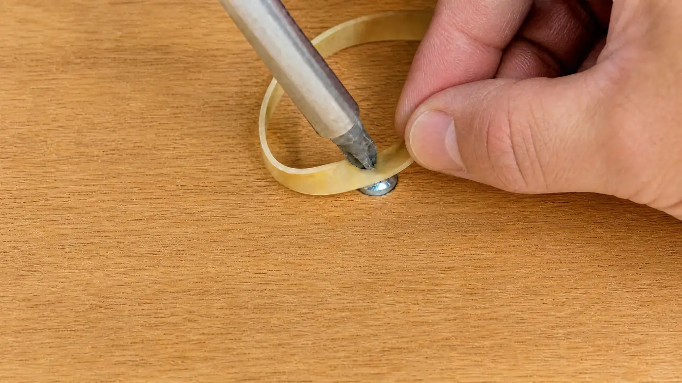 Rubber band method for how to remove a stripped screw with a manual screwdriver